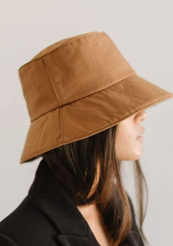 [Color: Brown] A nineties style cotton bucket hat by Gigi Pip. Fully packable and adjustable. 