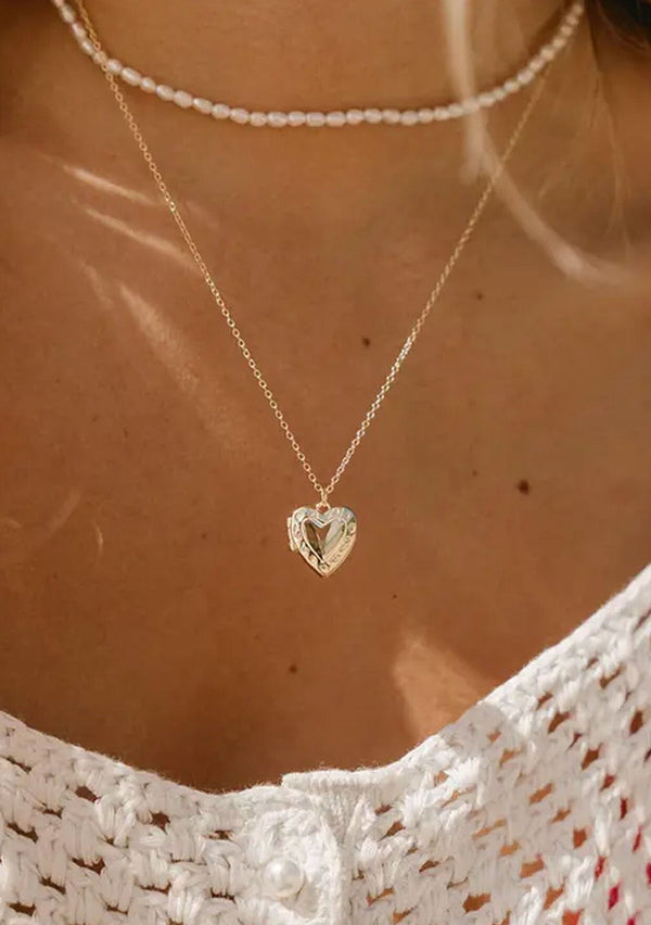 [Color: Gold] A classic heart shaped locket necklace made with fourteen karat gold plated sterling silver. Hypoallergenic and made in the USA. 
