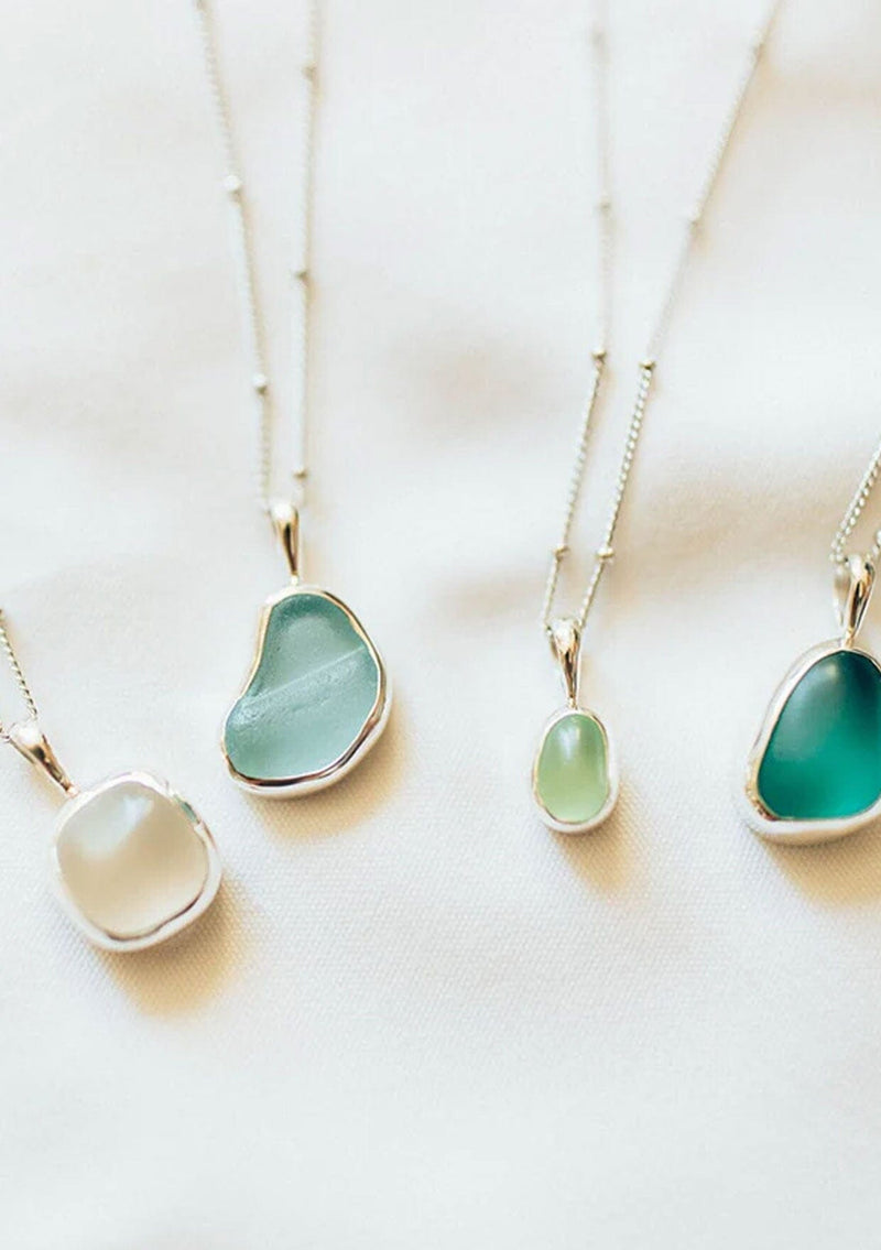 [Color: Green] A white gold plated sterling silver base necklace with a unique sea glass charm in green. 