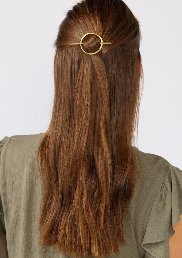 [Color: Brass] A brass oval hair slide.