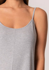 [Color: Heather Grey] A front facing image of a brunette model wearing a soft bamboo knit lounge jumpsuit in heather grey. A sleeveless one piece with adjustable spaghettis straps, a scoop neckline, a wide cropped leg, and side pockets.