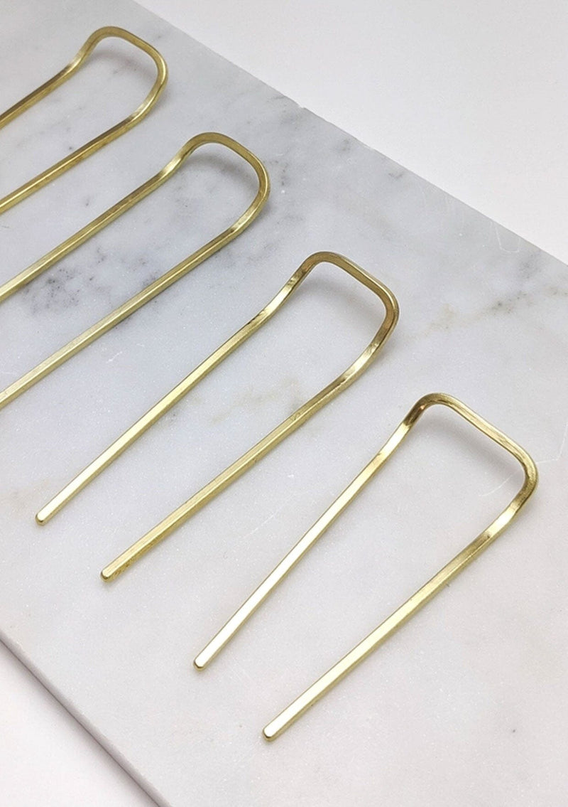 [Color: Brass] A simple hairpin handcrafted in the USA from recycled brass. 