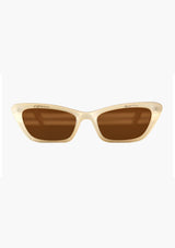 [Color: Espresso Martini] A pair of  cream, cat-eye frames with brown lenses. Made by INDY