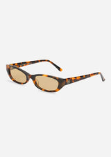 [Color: Tortoise] A pair of slim shaped brown tortoise acetate frames with tan tinted lenses. Made by INDY