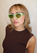 [Color: Lime Green] A modern take on the retro cat eye sunglasses in a lime green frame.