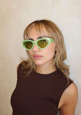 [Color: Lime Green] A modern take on the retro cat eye sunglasses in a lime green frame.