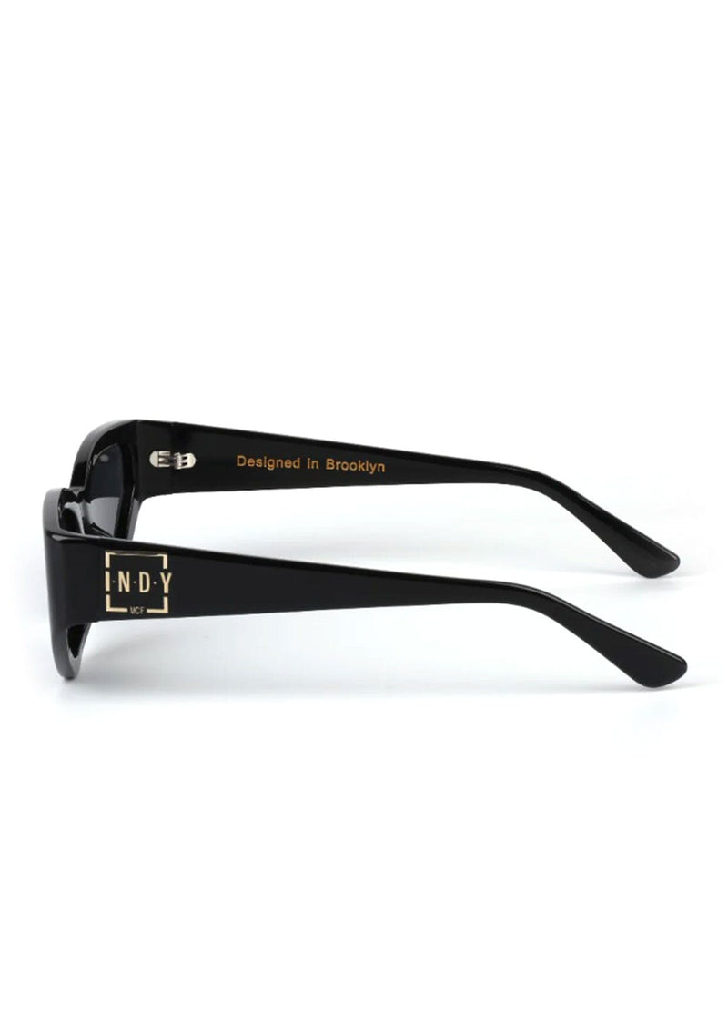 [Color: Black] A modern take on the retro cat eye sunglasses in a black frame.