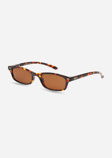 [Color: Espresso] A pair of slim, rectangle amber tortoise acetate frames with amber lenses. Made by INDY