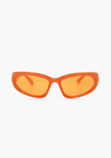 [Color: Orange] A pair of sporty, thick bright orange frames with amber orange lenses. Made by INDY
