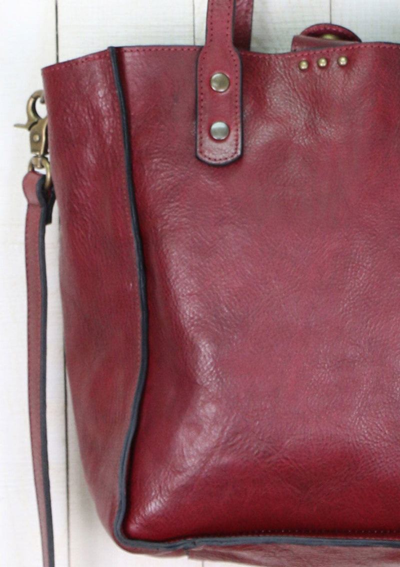 [Color: Mosto] Beautiful vintage style leather crossbody tote bag. With all the romance of an authentic vintage leather bag, our tote features subtle metal stud accents, a removable crossbody strap, and leather top handles.