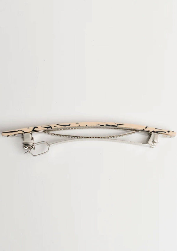 [Color: Marble] A larger sized barrette made with cellulose acetate and featuring a marble design. 