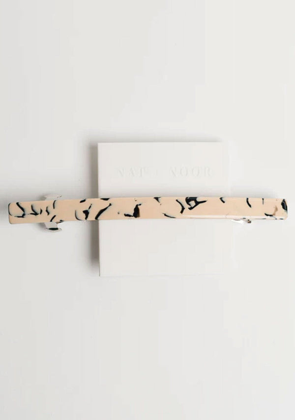 [Color: Marble] A larger sized barrette made with cellulose acetate and featuring a marble design. 