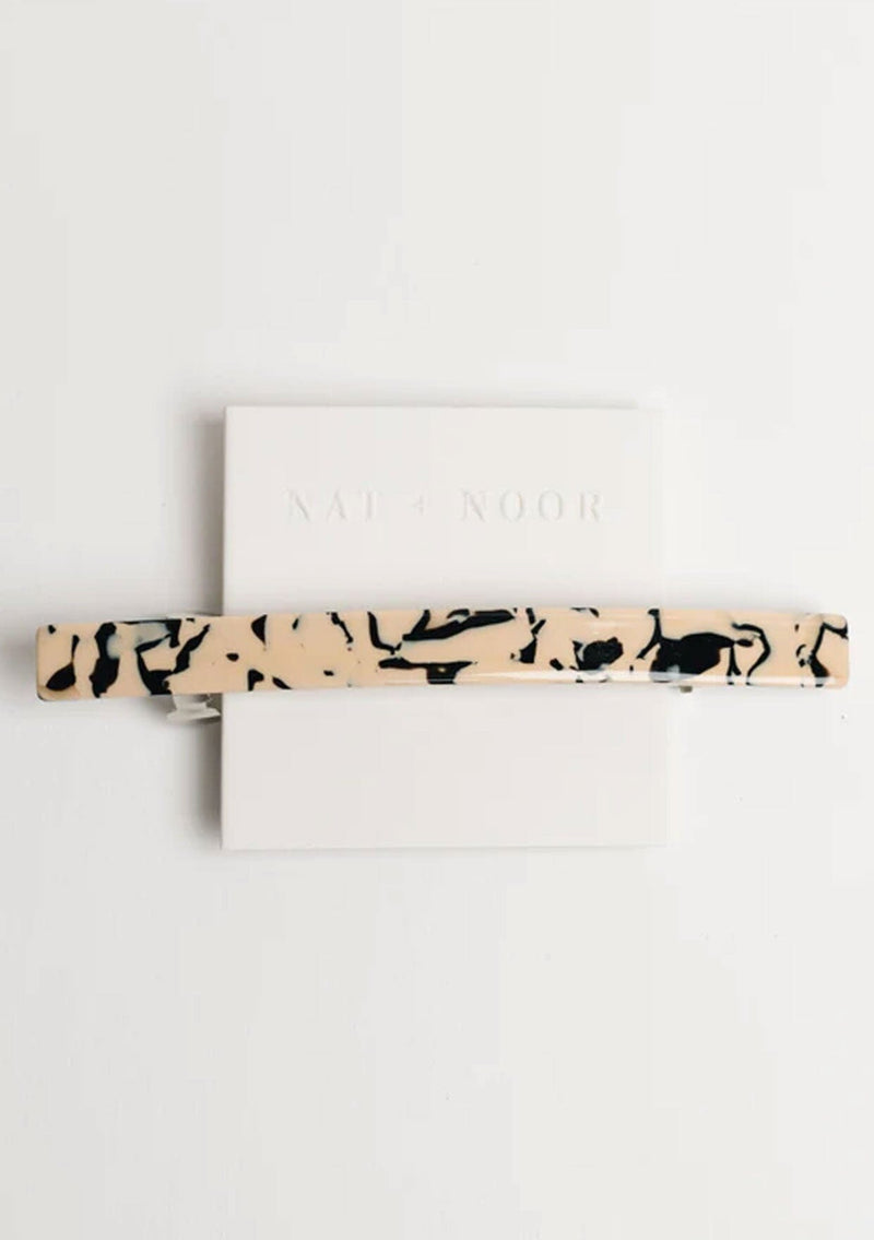 [Color: Marble] A black and cream marbled French style barrette.