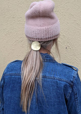 [Color: Brass] A sculptural brass ponytail holder with interchangeable hair elastic, made in the USA.