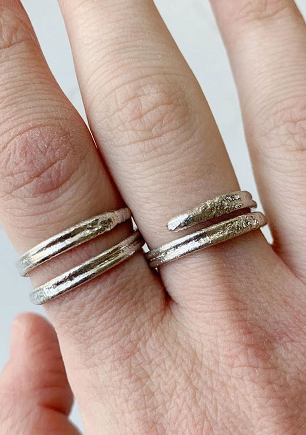 A take on the classic melted bar ring, this ring is adjustable and handcrafted in sterling silver.