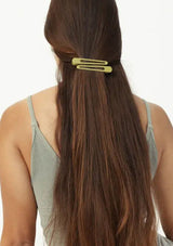 [Color: Olive] A set of two olive green metal hair clips. 