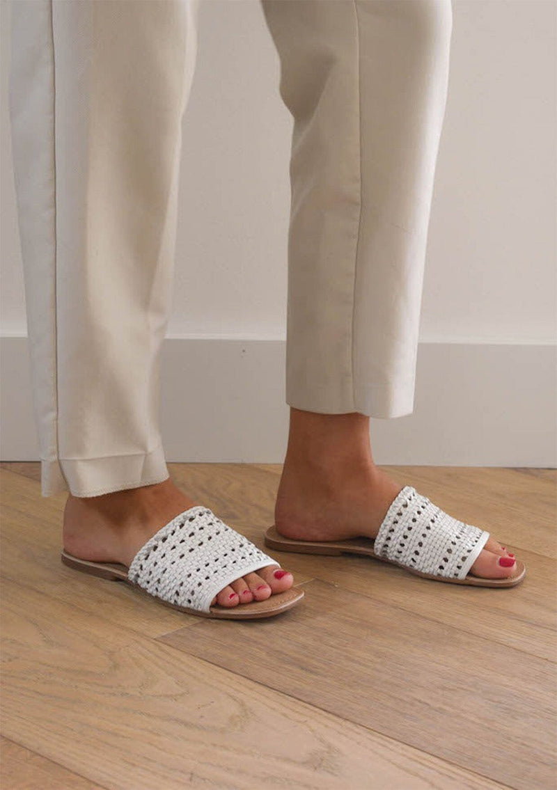 [Color: White] A summer handwoven white one hundred percent leather summer slide made with upcycled materials. Sustainably and ethically made in India.