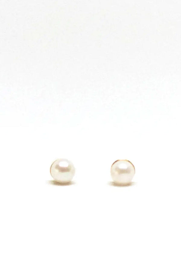 Classic pearl stud earrings, hypoallergenic and made in the USA. 