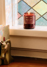 P.F. Candle in Silver Mist. A burgundy glass jar candle for the holidays. 
