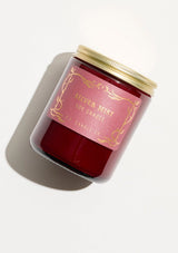 P.F. Candle in Silver Mist. A burgundy glass jar candle for the holidays. 