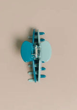 [Color: Robin] A two tone blue and teal medium sized hair clip by Nat and Noor. 