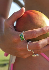 Hand wearing multiple rings 