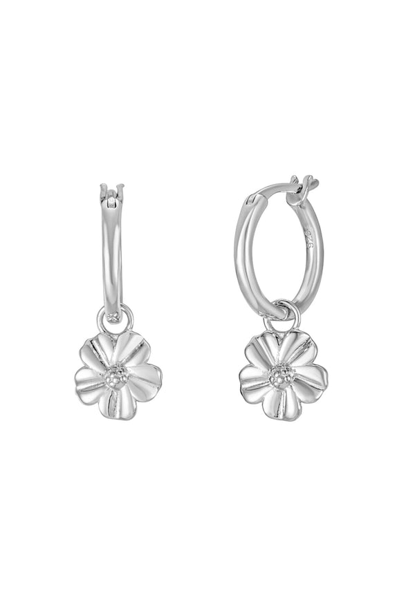 Silver hoop earrings with floral charm. 