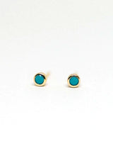 Simple, hypoallergenic, fourteen karat gold plated studs on a sterling silver base with a delicate faux turquoise stone. 