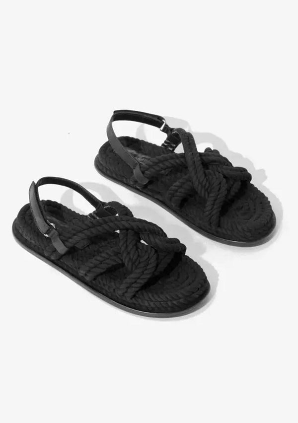 [Color: Black] A classic bohemian black rope sandal made with one hundred percent upcycled materials. With a slight platform and an adjustable Velcro strap. Sustainably and ethically made in India. 