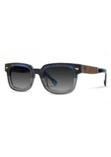 [Color: Cobalt] Sunglasses with a warm grey lens and a blue grey acetate frame.