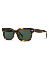 [Color: Jaguar] Sunglasses with a warm grey lens and a brown tortoise acetate frame.