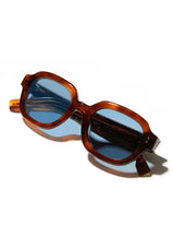 [Color: Burgundy] Acetate Sunglasses with brown frame and blue lenses made by Shwood. 