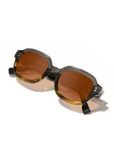 [Color: Oak Moss] Acetate Sunglasses with gradient brown lens and tan lenses made by Shwood. 