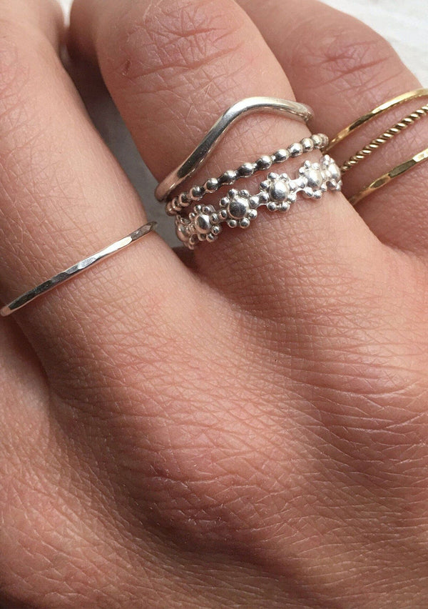 [Color: Silver Daisy] A daisy stacking ring hand made from sterling silver.