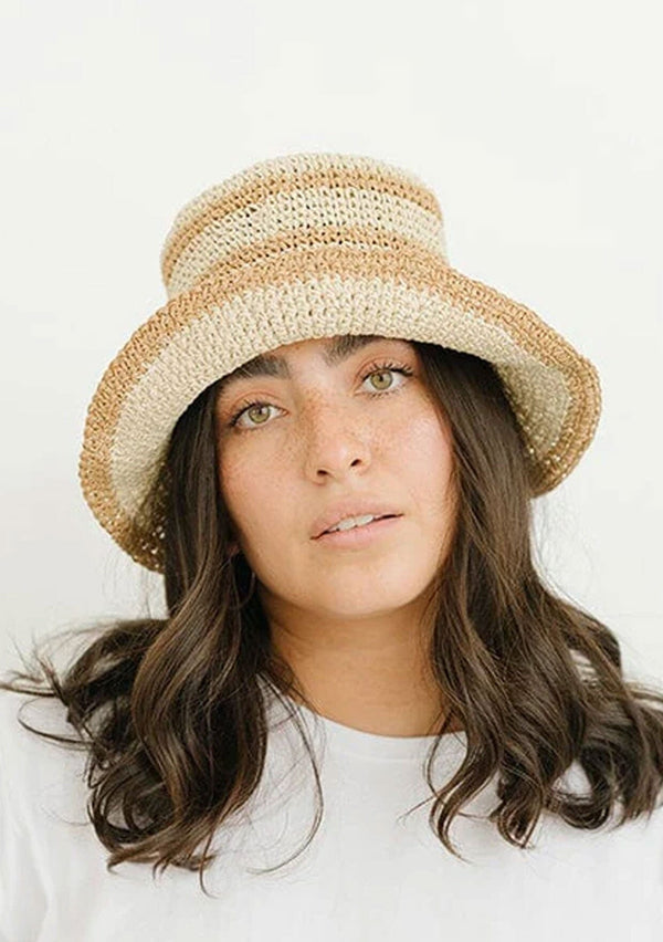 [Color: Natural Striped] A crochet Gigi Pip bucket hat in a natural stripe. A packable casual hat with a foldable brim. 