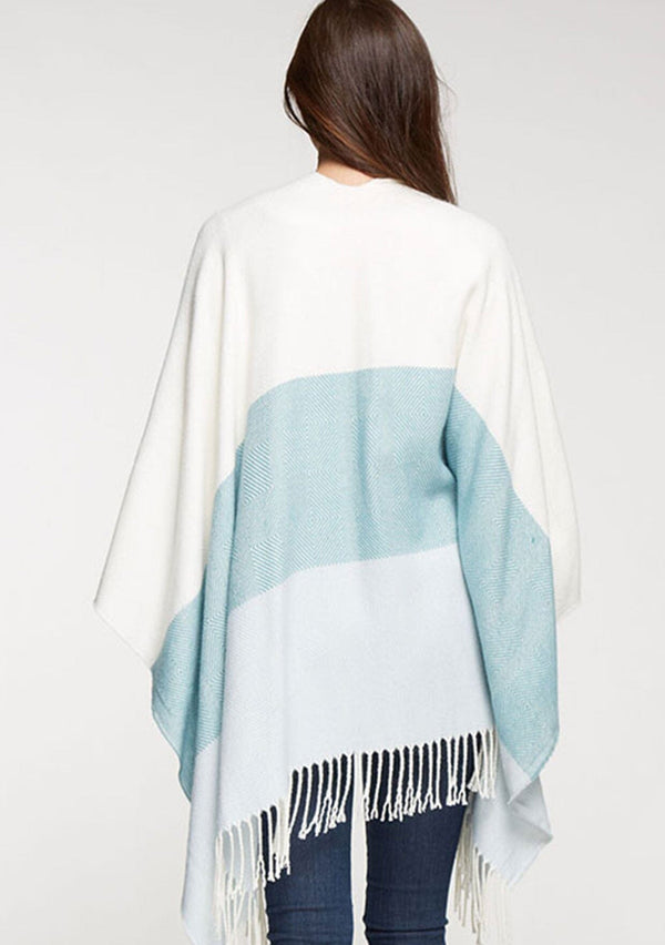 [Color: Vanilla/Mint] A bohemian fringed poncho in an ivory and mint block stripe.