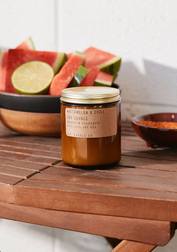 [Size: 7.2 oz Standard] PF Candle Company watermelon and chili candle.  Introducing Watermelon &amp; Chili, a limited edition scent inspired by carefree summers in Los Angeles. Available while supplies last.  Fresh cut fruit, hand-squeezed citrus, cool grass on a hot day. Tart yet earthy. Watermelon, summer grass, dried chili, and lime.