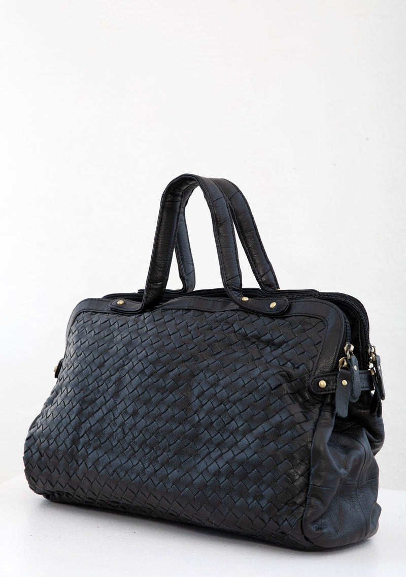 [Color: Black] A luxurious black woven leather bag. With two zippered compartments, a removable long leather crossbody strap, two leather top handles, and an exterior zippered pocket. 
