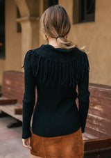 [Color: Black] Bohemian chic off shoulder ribbed sweater with fringe detail. 