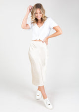 [Color: Ivory] Chic silky pink mid length skirt with subtle dot print detail