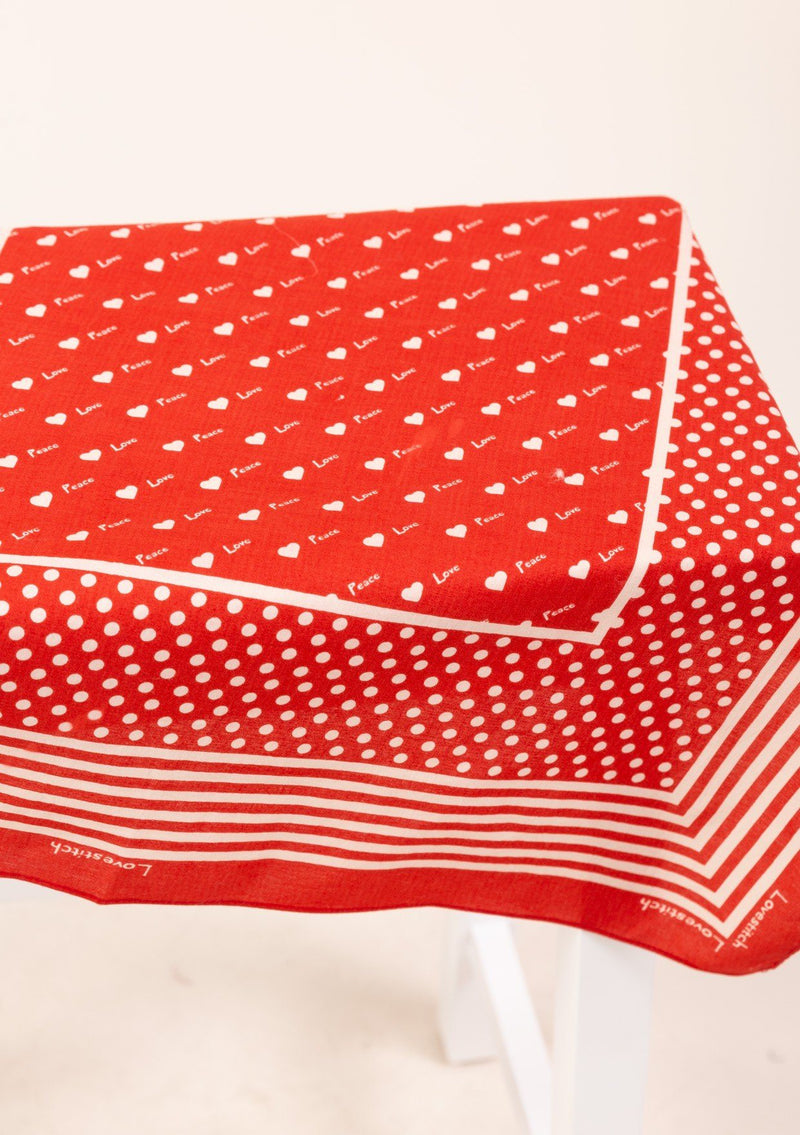 [Color: Red] A timeless and essential bohemian accessory, our square bandana features a dot and stripe print border, mini hearts, and alternating Love and Peace printed throughout. 