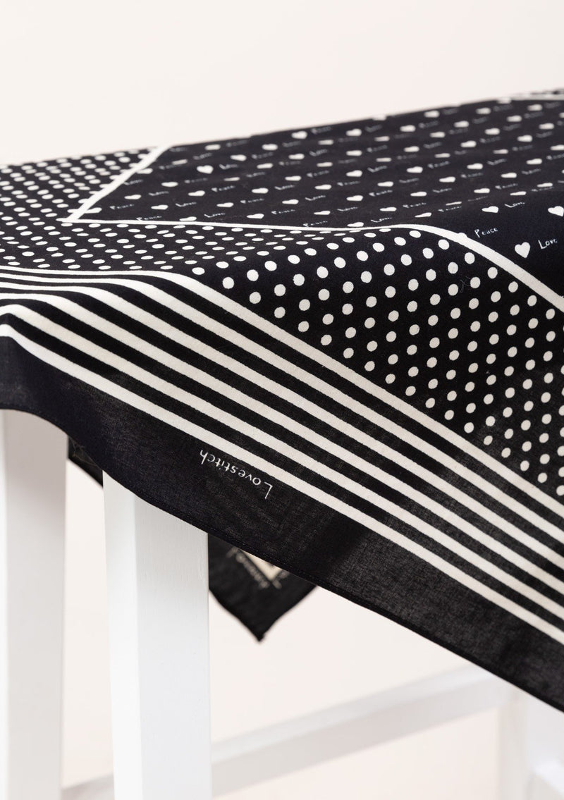 [Color: Black] A timeless and essential bohemian accessory, our square bandana features a dot and stripe print border, mini hearts, and alternating Love and Peace printed throughout. 