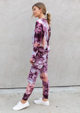 [Color: Berry Peach] A casual pink and orange tie dye crewneck pullover sweatshirt.