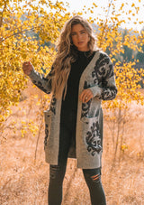 [Color: Heather Grey Midnight] A beautiful metallic jacquard wrap cardigan. Featuring a wrap front with a waist defining belted tie closure and essential side pockets. A beautiful statement sweater with light catching metallic details.