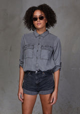 [Color: Charcoal] An ultra soft tie front top, featuring front flap patch pockets, button tab rolled sleeves and a trendy tie front detail. Paired here with denim.