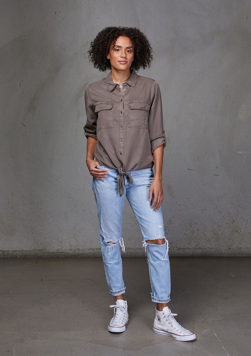 [Color: Mushroom] An ultra soft tie front top, featuring front flap patch pockets, button tab rolled sleeves and a trendy tie front detail. Paired here with denim.