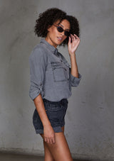 [Color: Charcoal] An ultra soft tie front top, featuring front flap patch pockets, button tab rolled sleeves and a trendy tie front detail. Paired here with denim.