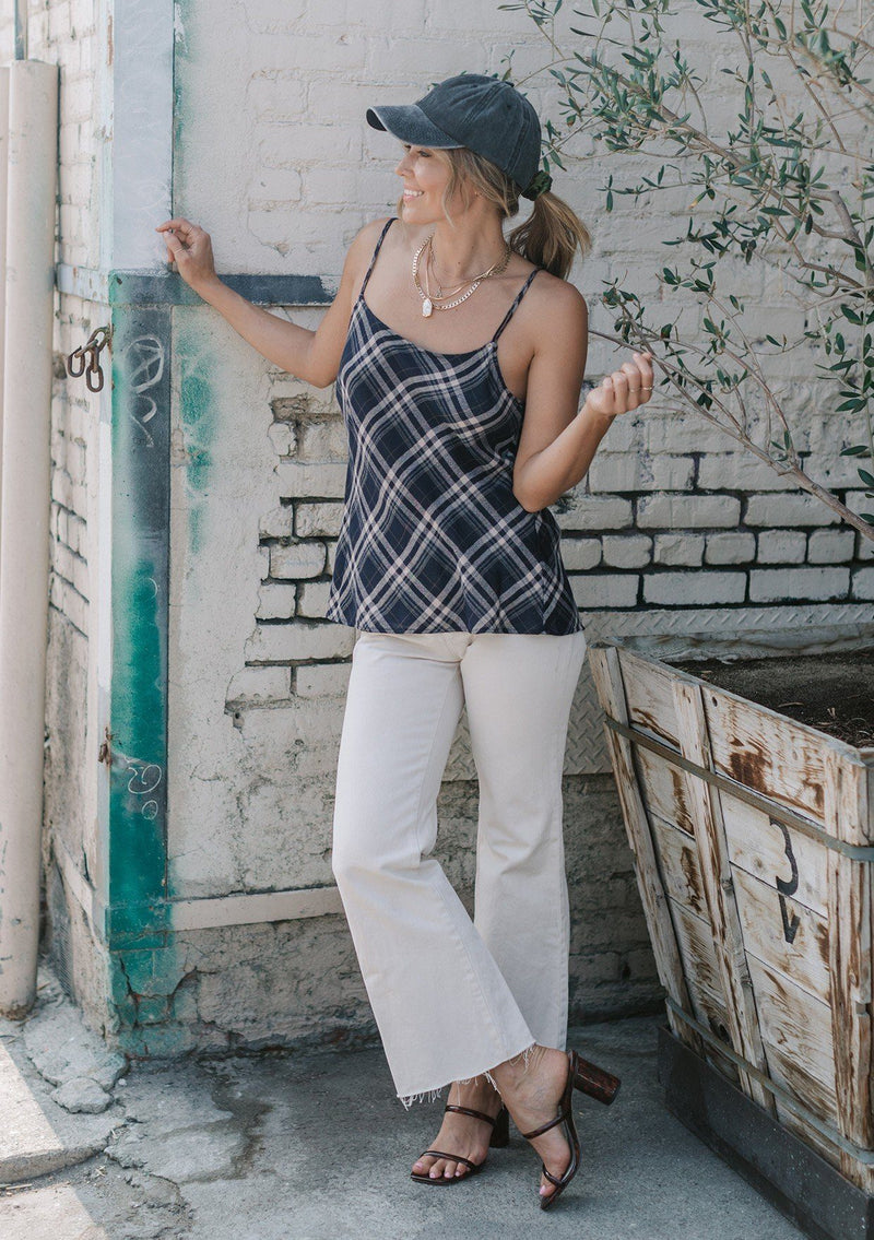 [Color: Navy] A lightweight cotton plaid camisole featuring a sexy wrap back detail with side tie closure, double spaghetti straps, and a flattering scooped neckline. An ultra cute style that is paired here with denim and heeled sandals.