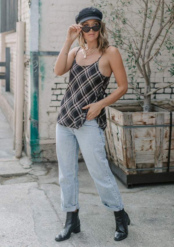 [Color: Black] A lightweight cotton plaid camisole featuring a sexy wrap back detail with side tie closure, double spaghetti straps, and a flattering scooped neckline. An ultra cute style that is paired here with denim and heeled sandals.