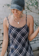 [Color: Navy] A lightweight cotton plaid camisole featuring a sexy wrap back detail with side tie closure, double spaghetti straps, and a flattering scooped neckline. An ultra cute style that is paired here with denim and heeled sandals.